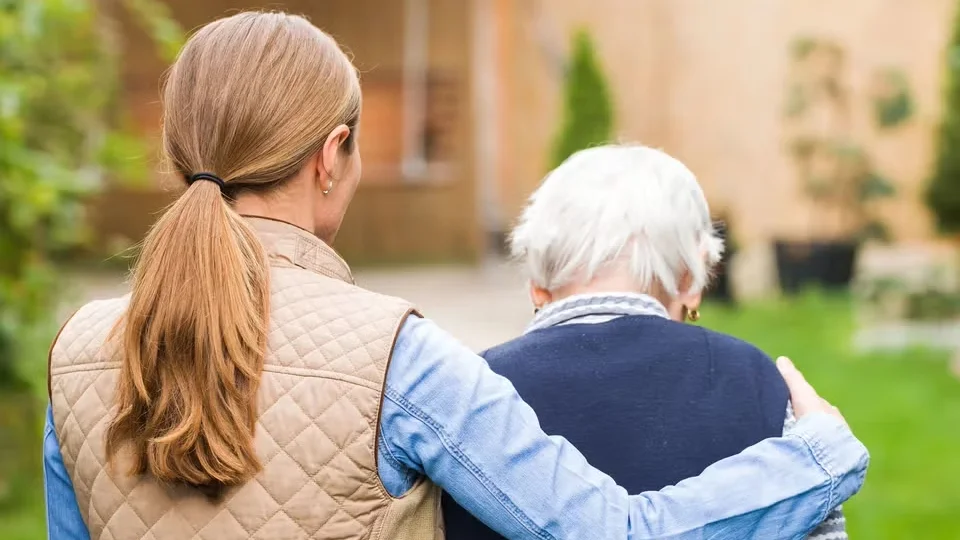 Two people waking with their backs turned